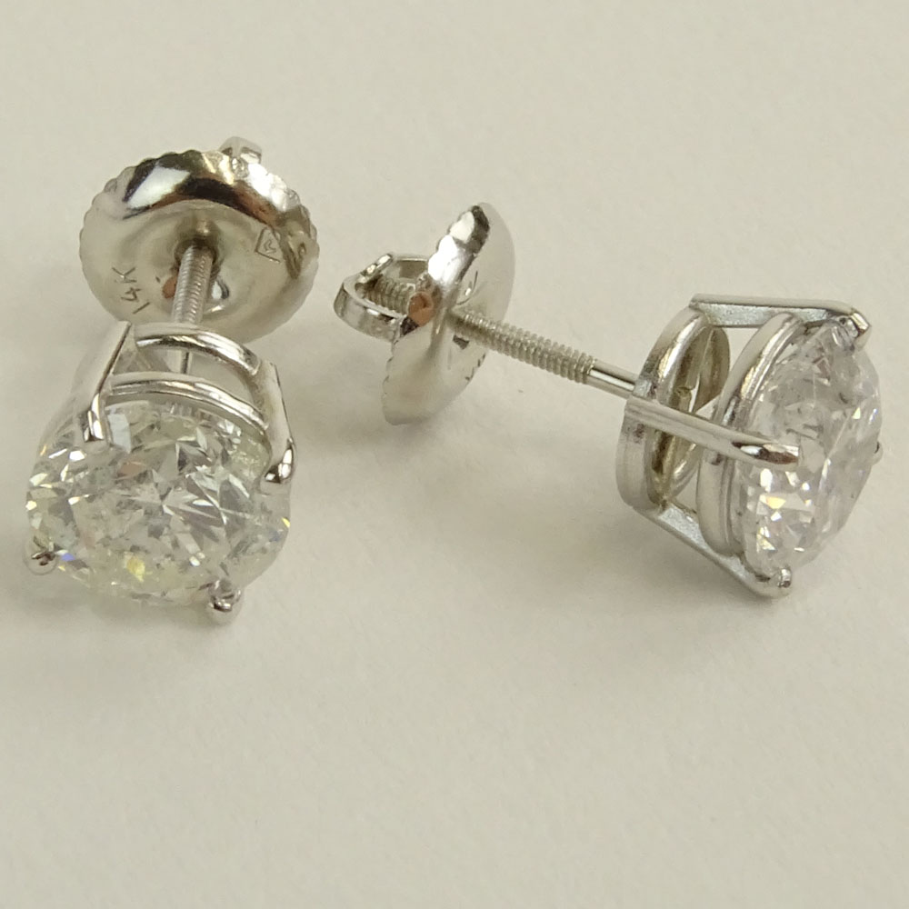 AIG Certified 2.47 Carat, total weight, Round Brilliant Cut Diamond and 14 Karat White Gold Earstuds.