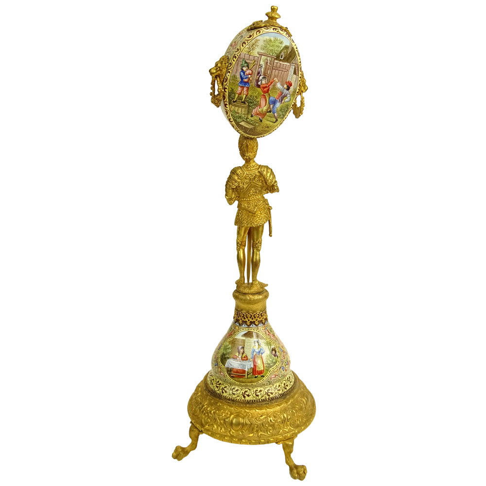 Early 20th Century Vienna Enamel and Gilt Metal Watch Holder. Unsigned. Losses/Damages to finial and to watch holder. Please examine this lot carefully before bidding. Measures 13-1/2" H (without bird finial), 4" W at base. Shipping $48.00 (estimate $500-
