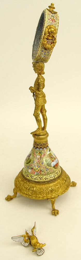 Early 20th Century Vienna Enamel and Gilt Metal Watch Holder. Unsigned. Losses/Damages to finial and to watch holder. Please examine this lot carefully before bidding. Measures 13-1/2" H (without bird finial), 4" W at base. Shipping $48.00 (estimate $500-