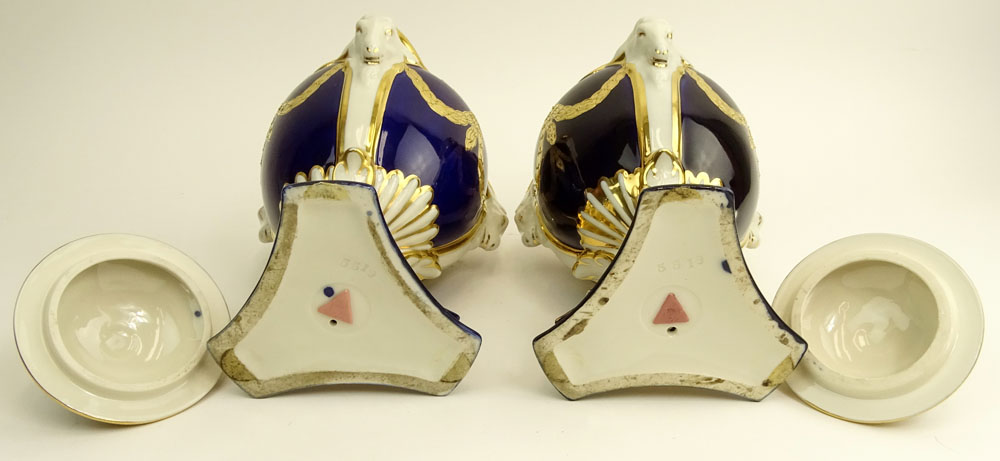 Pair Royal Dux Porcelain Cobalt and Parcel Gilt Covered Urns. Ram's head handles.
