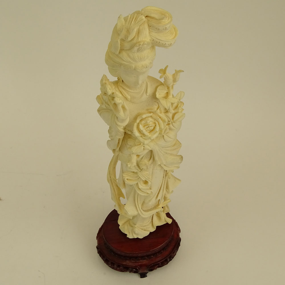 Mid 20th Century Chinese Carved Ivory Guanyin Figure on Carved Wood Base.