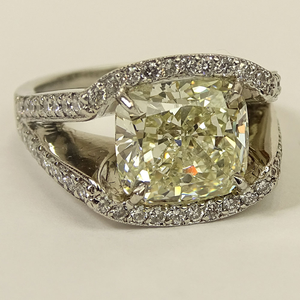 Important Approx. 7.01 Carat Cushion Cut Diamond and Platinum Ring accented with Micro Pave Set Diamonds Throughout.