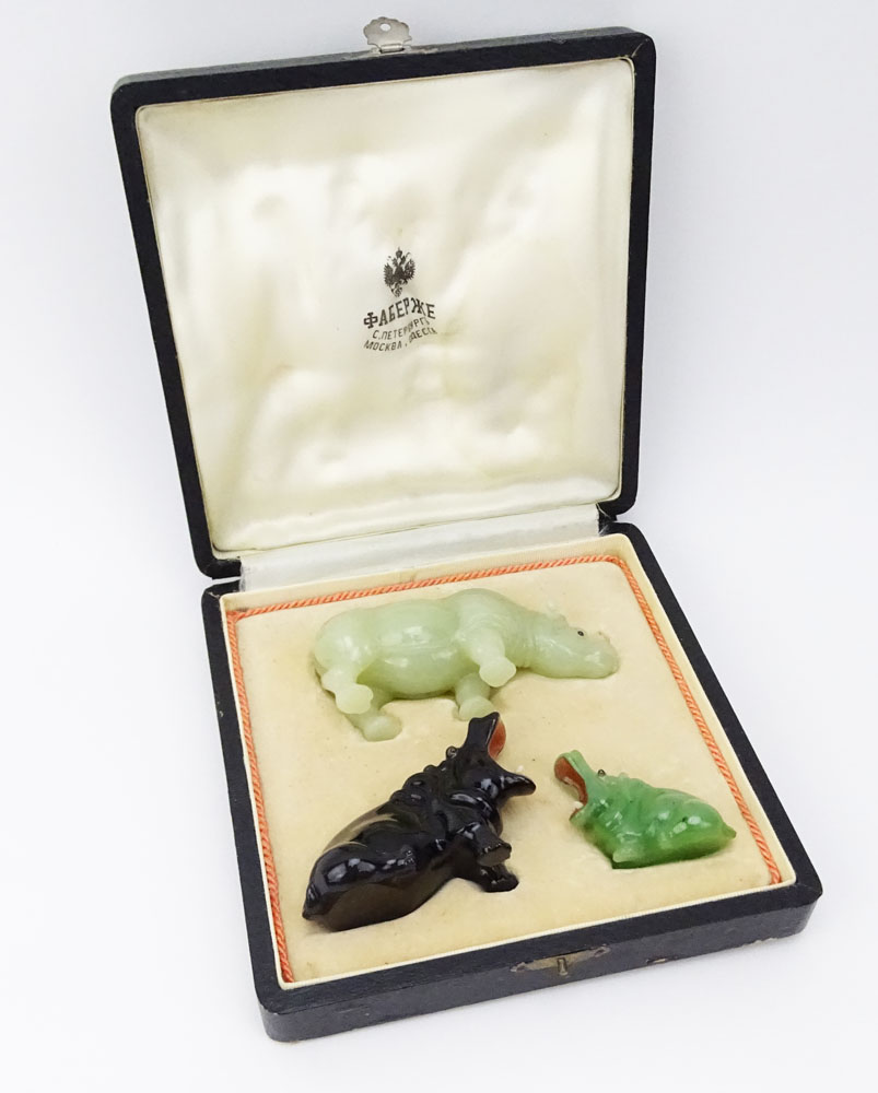 Collection of Three (3) 20th Century Russian Carved Stone Animal Figures Including a Carved Jade Rhino, a Carved Obsidian Hippo and a Miniature Carved Jade Hippo all in a fitted wood box signed Faberge