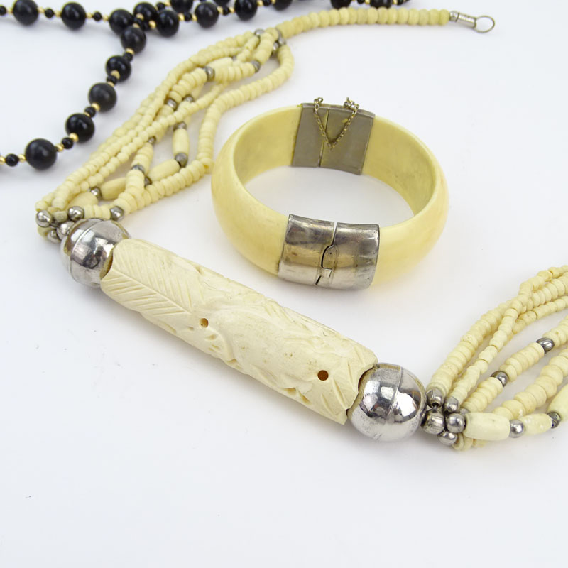 Three Piece Lot Including Carved and Black Onyx Bead Necklace, Carved Bone Necklace and Bangle Bracelet