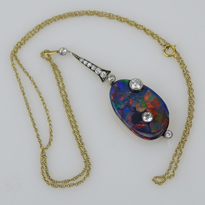 Art Nouveau Australian Free Formed Black Opal, European Cut Diamond, Platinum and 14 Karat Yellow Gold Pendant with 14 Karat Yellow Gold Chain