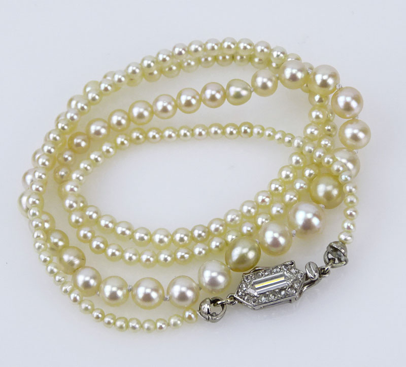 Exquisite Cartier GIA Certified Art Deco Graduated Natural Saltwater Pearl Necklace with Platinum and Diamond Clasp
