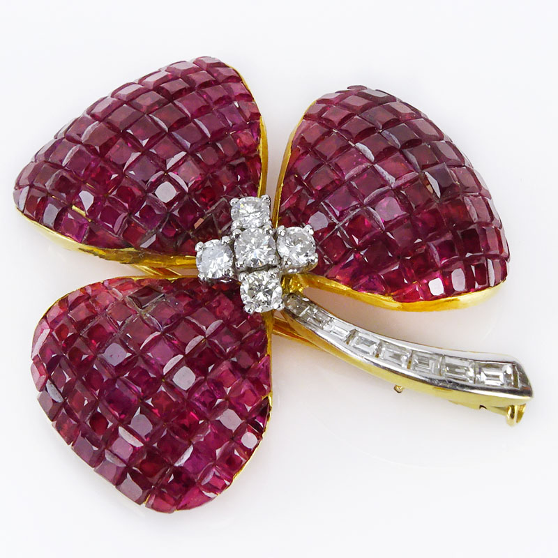  32.50 Carat Invisible Set Square Cut Ruby, .58 Carat Diamond and 18 Karat Yellow Gold Flower Brooch.