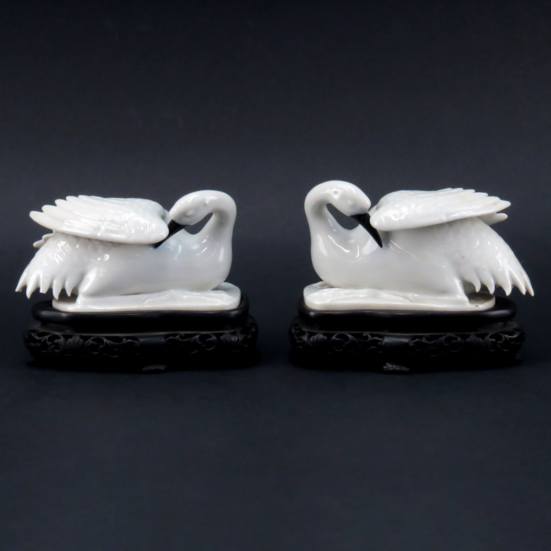 Pair of Chinese Blanc De Chine Swan Figures on Hardwood Stands