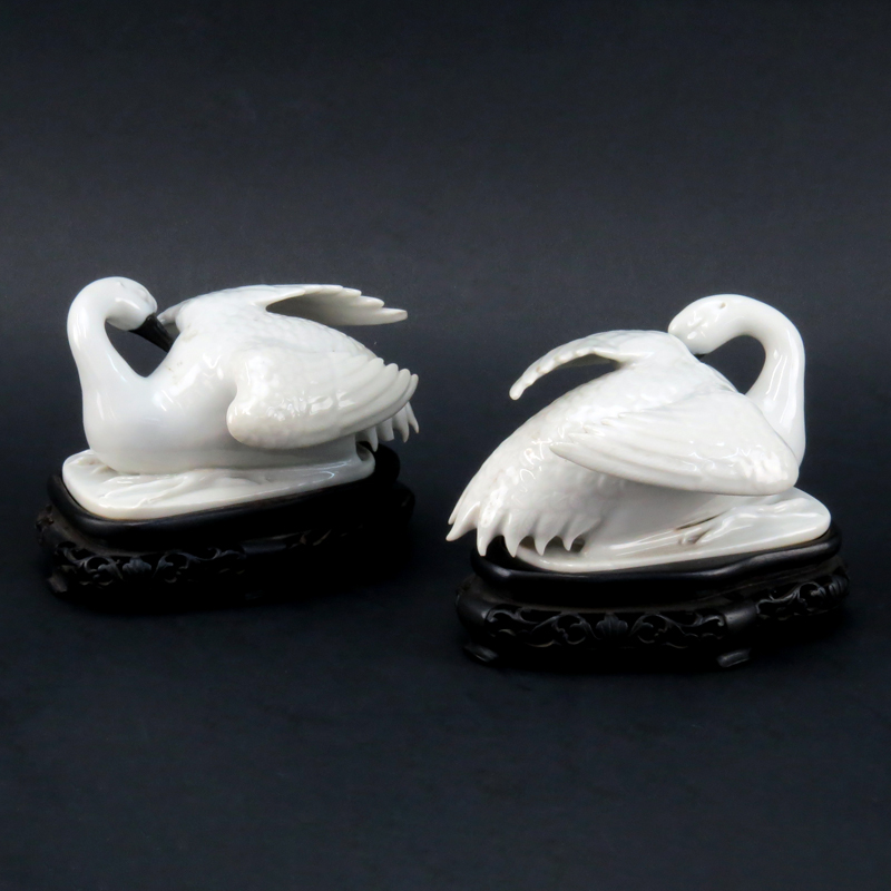 Pair of Chinese Blanc De Chine Swan Figures on Hardwood Stands