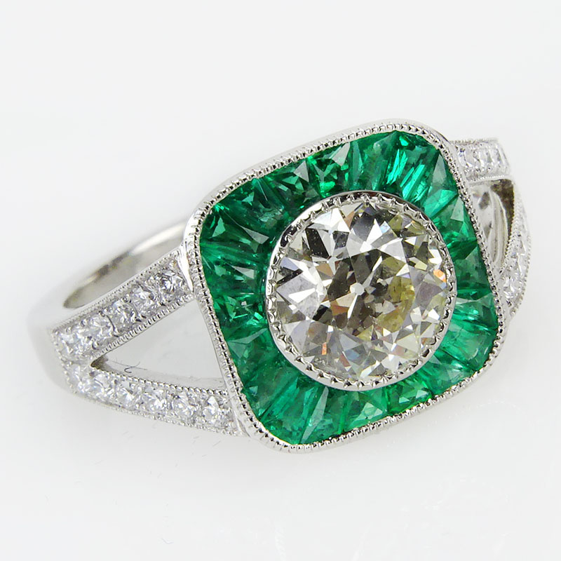 1.63 Carat TW Diamond, .55 Carat Emerald and Platinum Ring set 