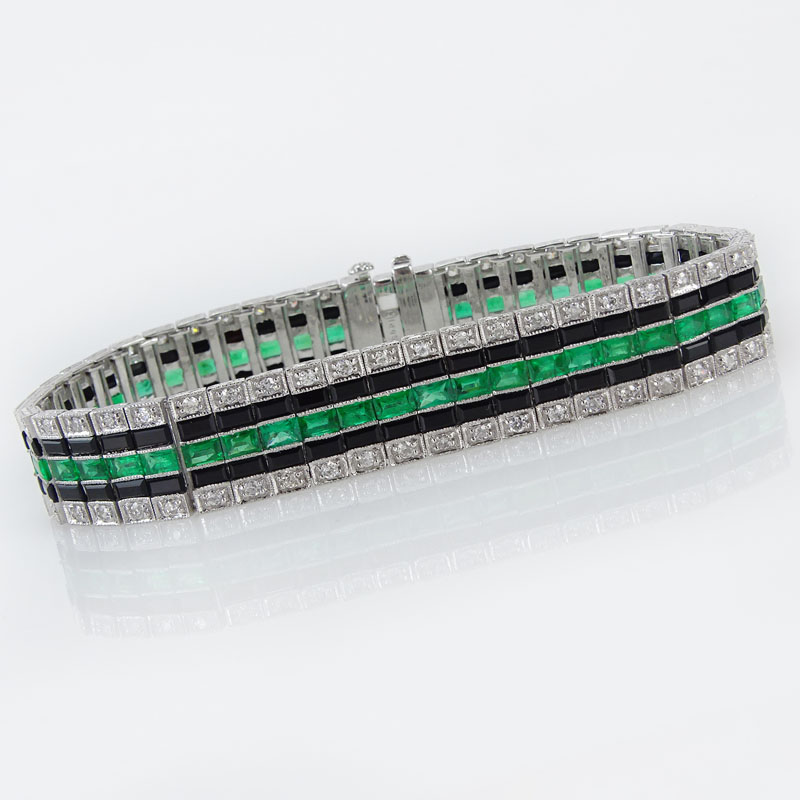 5.13 Carat Calibre Cut Emerald, 1.82 Carat Round Cut Diamond, Black Onyx and Platinum Bracelet.