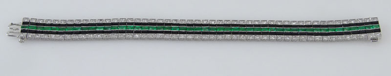 5.13 Carat Calibre Cut Emerald, 1.82 Carat Round Cut Diamond, Black Onyx and Platinum Bracelet.