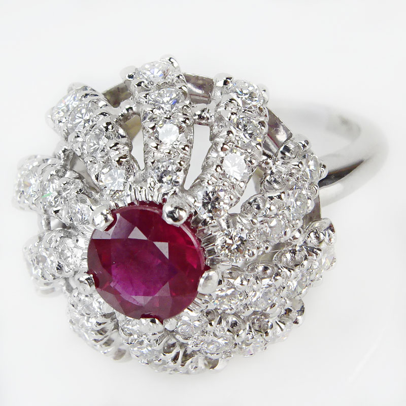 Circa 1940 Approx. 2.25 Carat Round Brilliant Cut Diamond, 1.40 Carat Round Cut Ruby and Platinum Ring