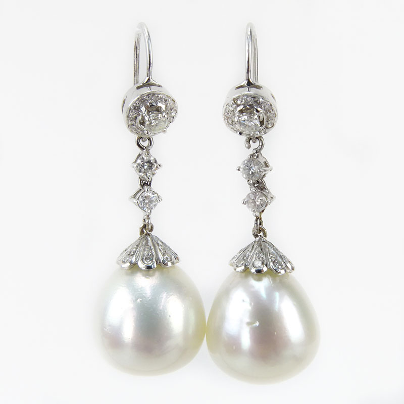 91 Carat Round Brilliant Cut Diamond and 18 Karat White Gold Pendant Earrings. Pearls with good luster, minor natural blemishes. 
