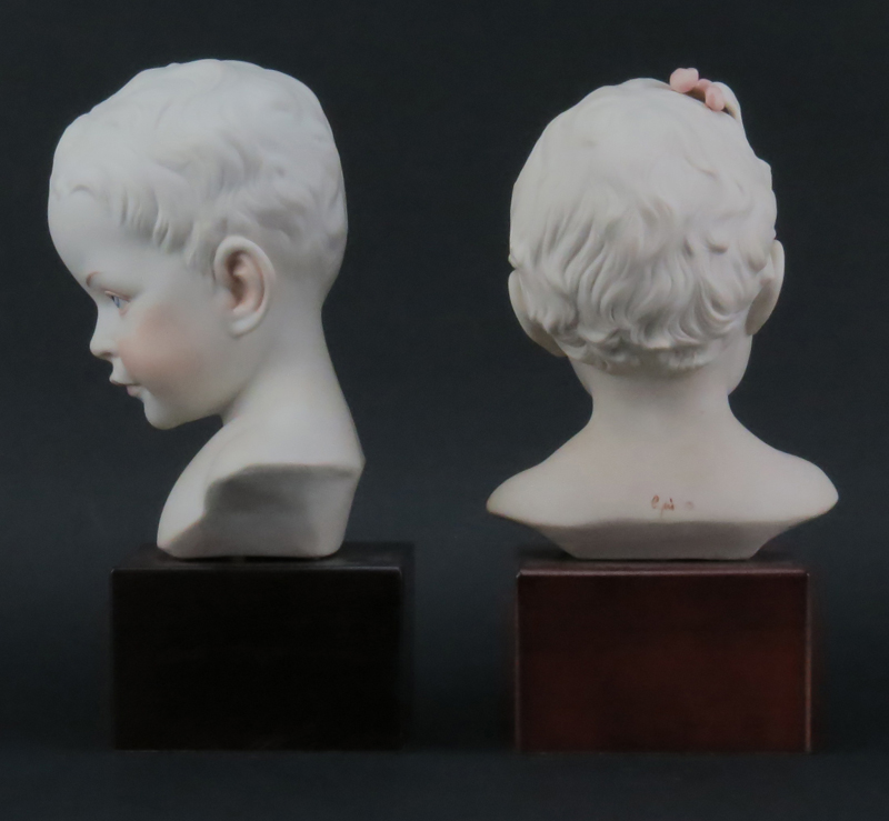 Pair of Cybis Polychrome Young Baby Boy and Girl Porcelain Busts Mounted on Wooden Bases