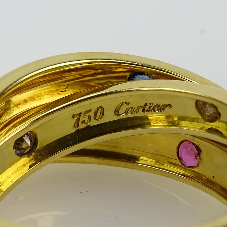 Cartier 18 Karat Yellow Gold Approx. .20 Carat Diamond, .25 Carat Sapphire and .25 Carat Ruby Trinity Ring.