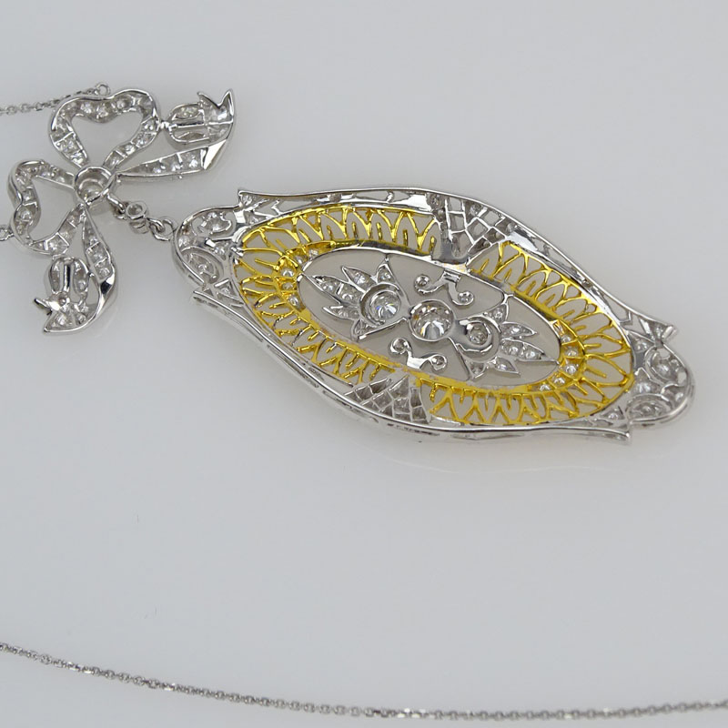 Antique style Approx. 1.0 Carat Diamond and 14 Karat Yellow and White Gold Pendant Necklace.
