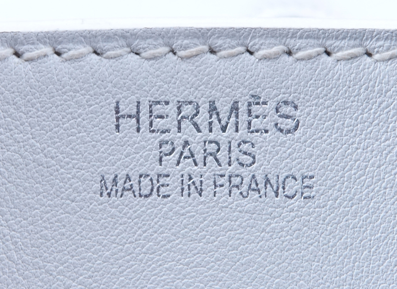 Hermès White Swift Leather Birkin 35 Bag. Palladium hardware. Interior with zipper and slot pocket. Clochette, keys and lock included as well as dust bag. 