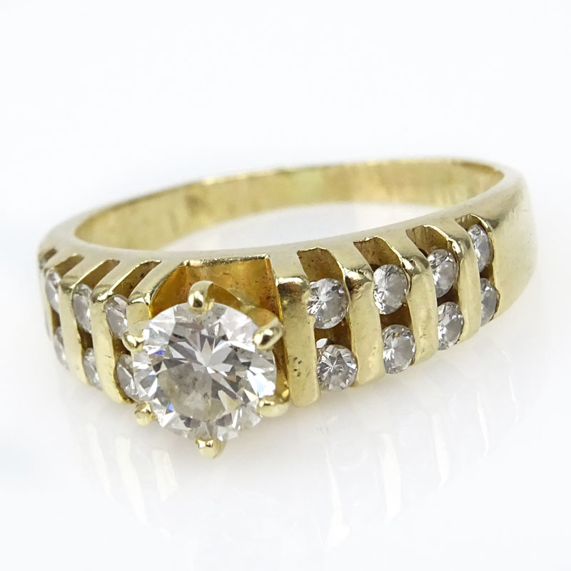 Approx. 1.25 Carat TW Round Brilliant Cut Diamond and 14 Karat Yellow Gold Engagement Ring.