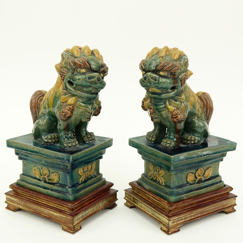Pair Chinese Sancai Glaze Pottery Foo Dog Figures on Wood Bases.