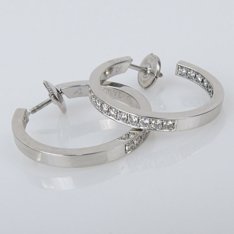 Cartier Approx. 1.20 carat Round Brilliant Cut Diamond and 18 Karat White Gold Inside Out Hoop Earrings.