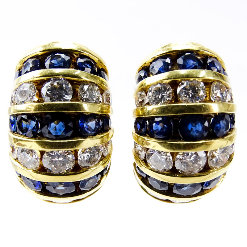 Approx. 4.04 Carat Channel Set Sapphire, 3.24 carat Channel Set Round Brilliant Cut Diamond and 18 Karat Yellow Gold Earrings. 