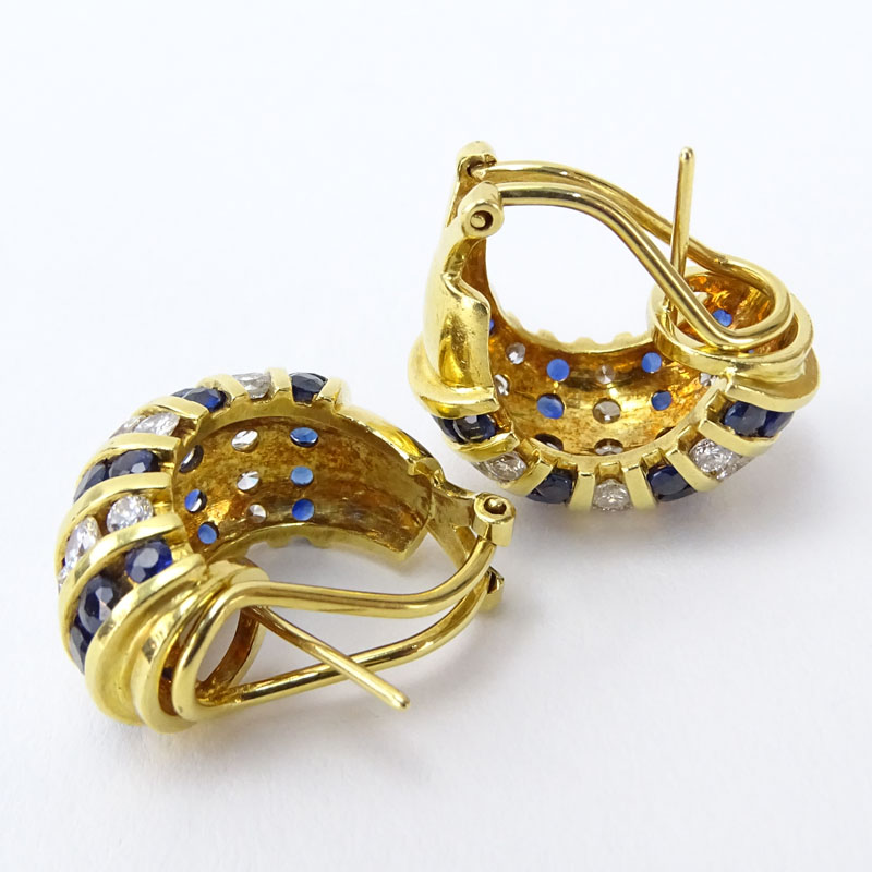 Approx. 4.04 Carat Channel Set Sapphire, 3.24 carat Channel Set Round Brilliant Cut Diamond and 18 Karat Yellow Gold Earrings. 