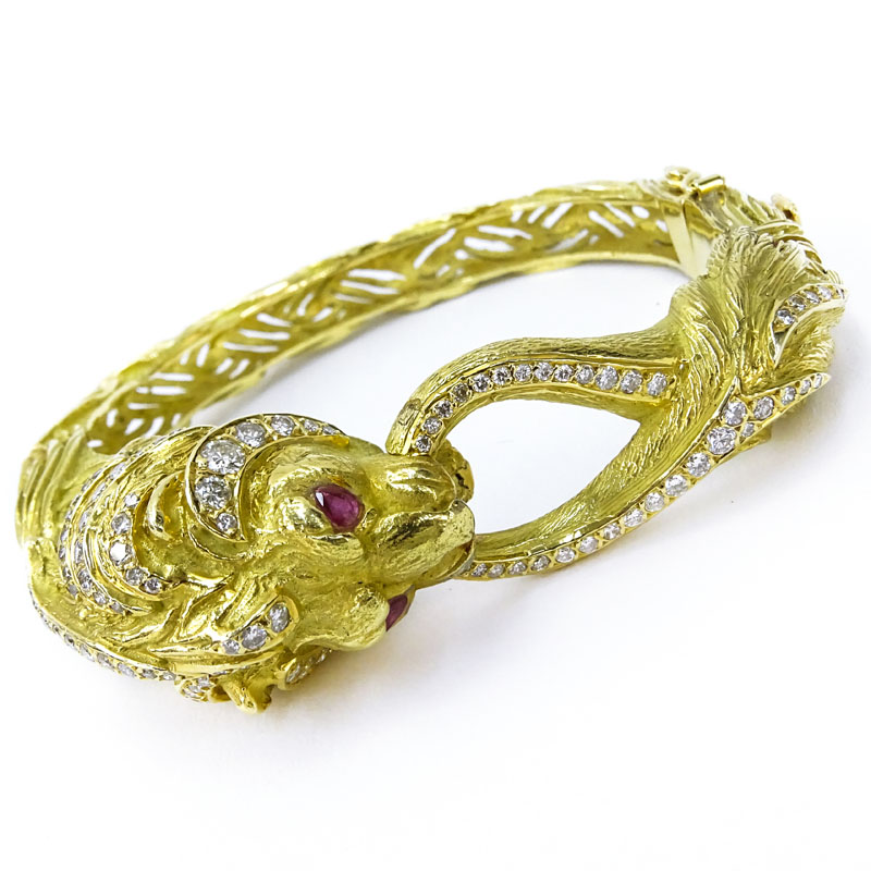 Vintage Approx. 3.57 Carat Round Brilliant Cut Diamond, Ruby and Heavy 18 Karat Yellow Gold Lion Bangle Bracelet.