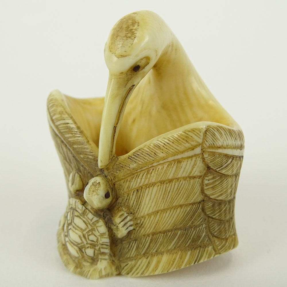 Early 20th Century Japanese Baisho Shop Carved Netsuke In The Form of a Stork and Turtle.