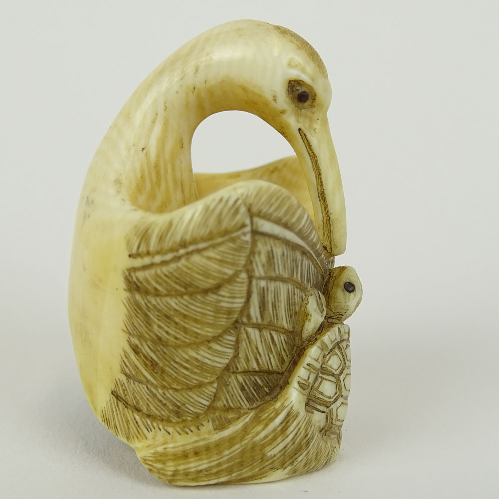 Early 20th Century Japanese Baisho Shop Carved Netsuke In The Form of a Stork and Turtle.