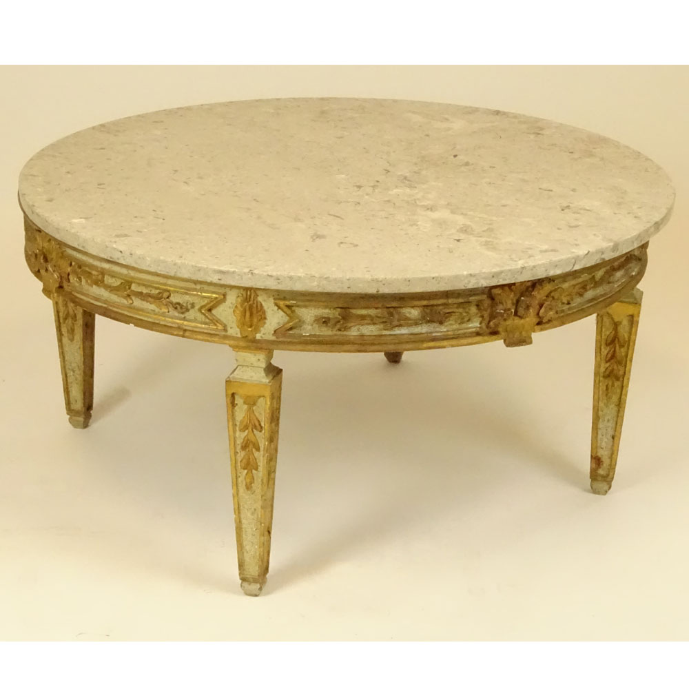 Mid 20th Century Italian carved and parcel gilt wood coffee table with marble top.