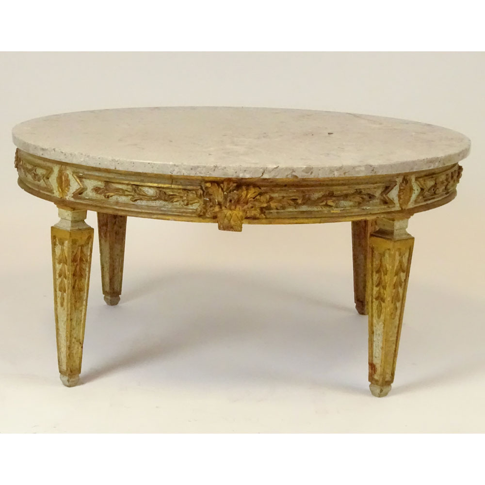 Mid 20th Century Italian carved and parcel gilt wood coffee table with marble top.