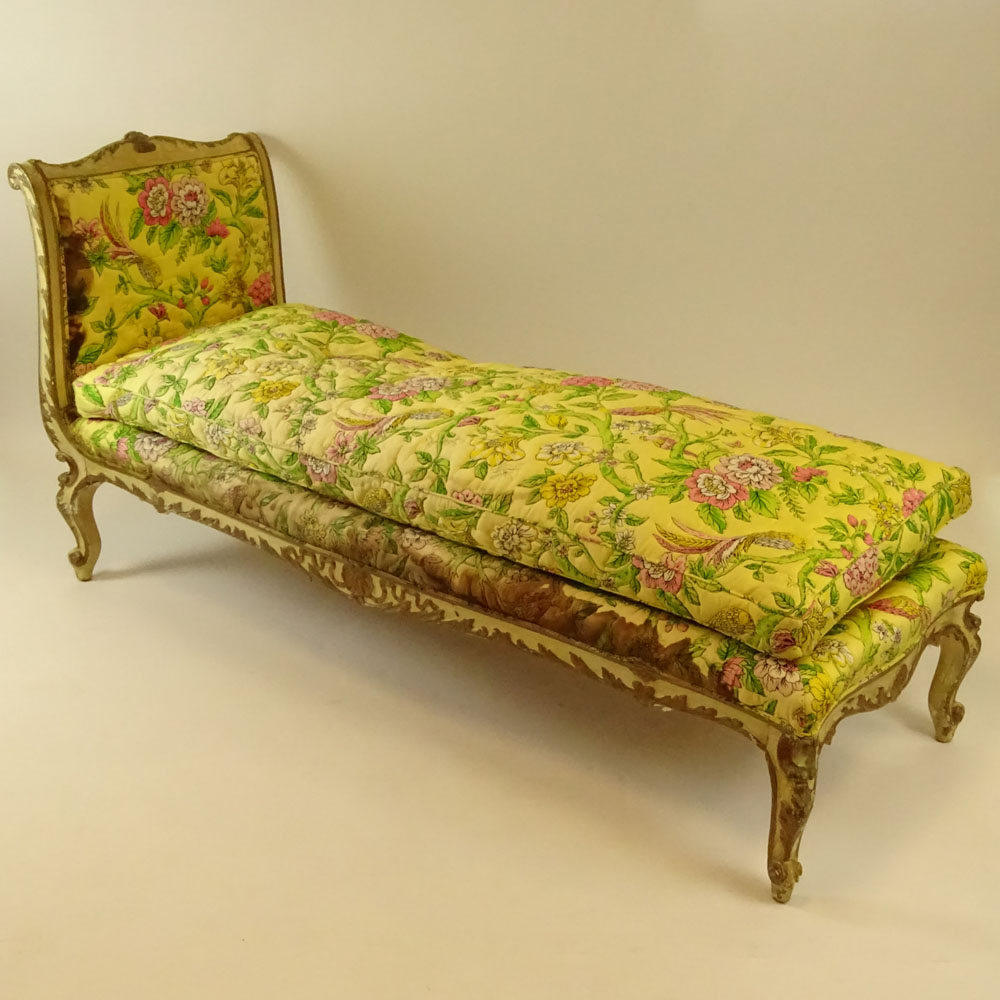 19th Century Italian carved, painted and parcel gilt chaise lounge. 