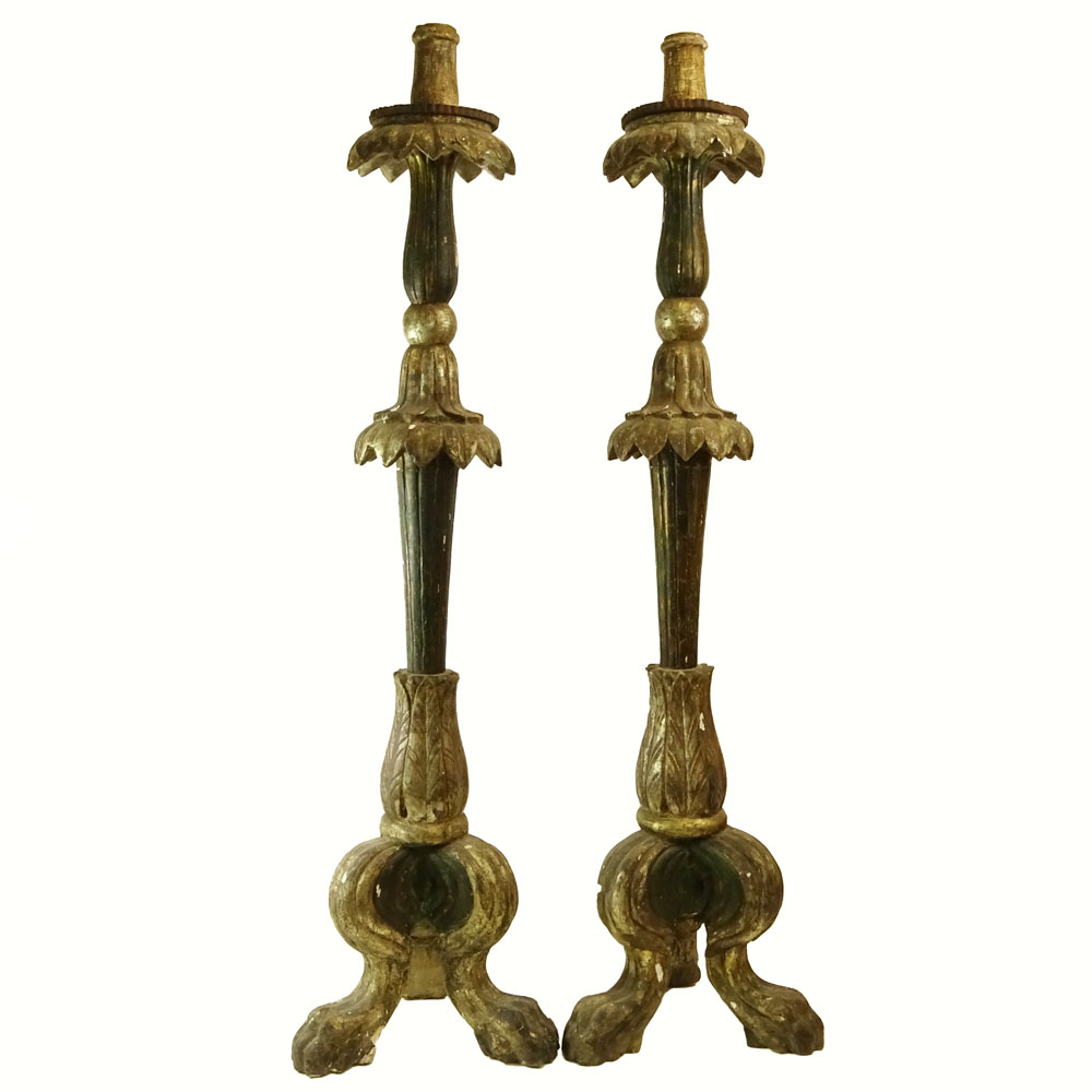 Pair of early 20th Century Italian carved painted and silver gilt candle torchieres.