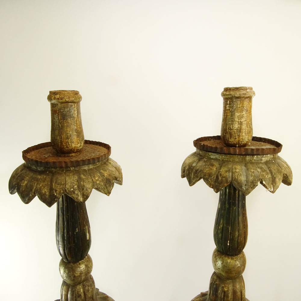 Pair of early 20th Century Italian carved painted and silver gilt candle torchieres.