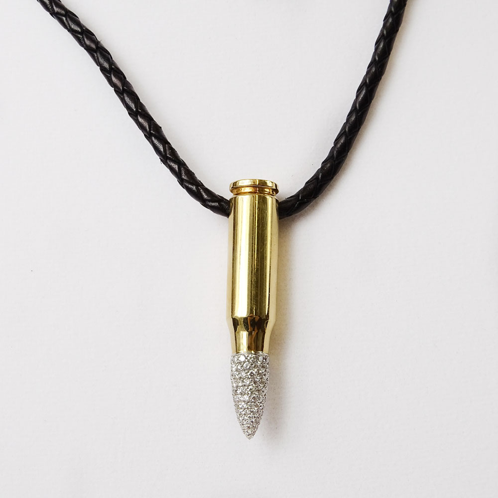 18 Karat Yellow AK-47 Bullet Pendant with 2.0 Carat Pave Set Round Cut Diamond Tip and with Braided Leather Necklace.