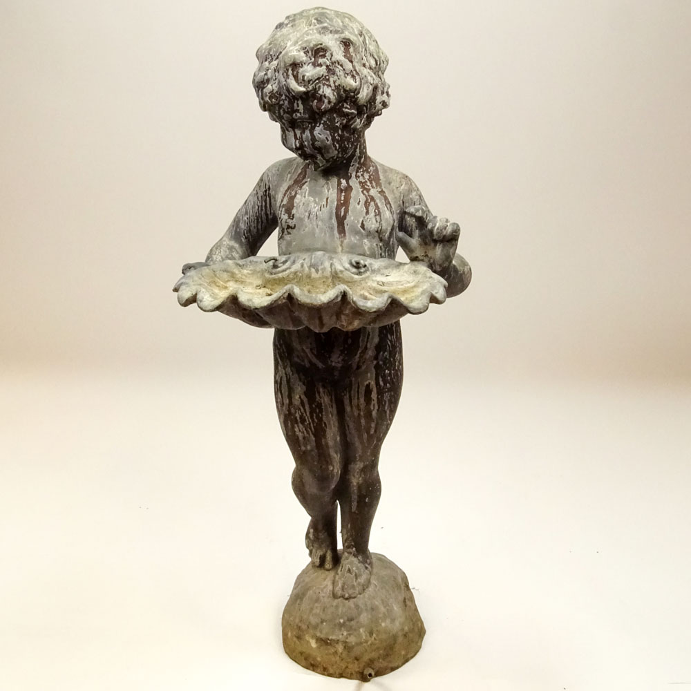 Early 20th Century Iron Figural Standing Putto holding Shell Fountain.