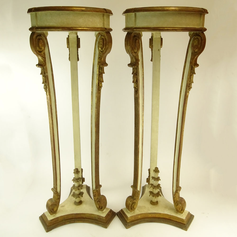 Pair of Early 20th Century probably Italian Carved Painted and Parcel Gilt Wood Pedestals.