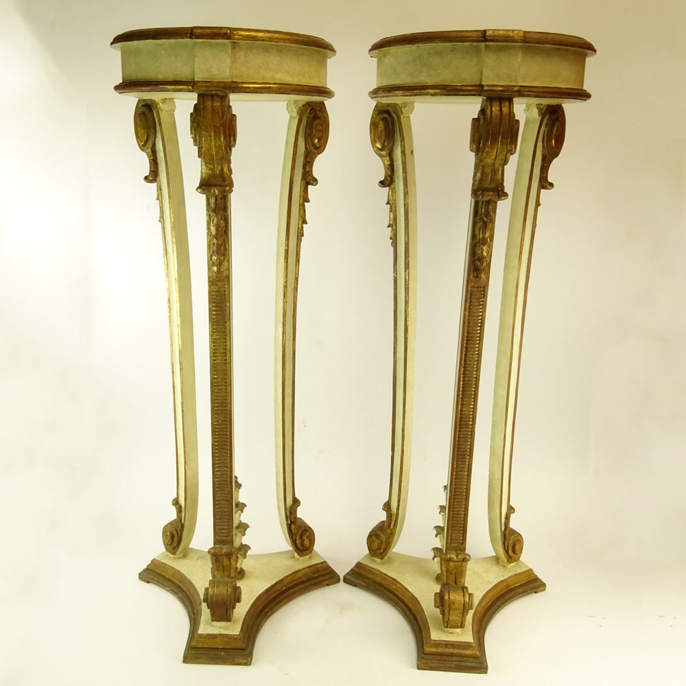 Pair of Early 20th Century probably Italian Carved Painted and Parcel Gilt Wood Pedestals.