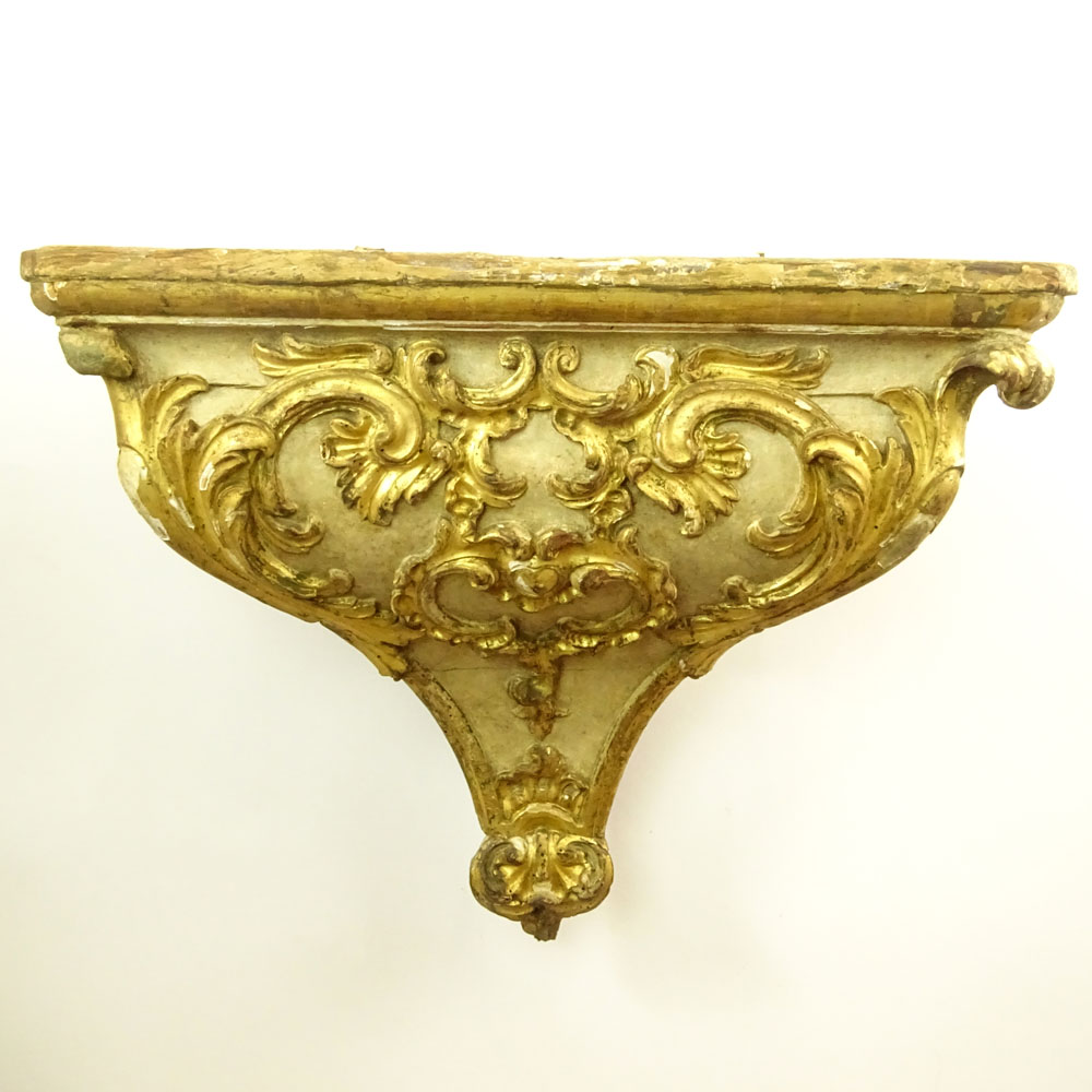 19/20th Century Probably Italian Carved Parcel Gilt Wood Wall Bracket.