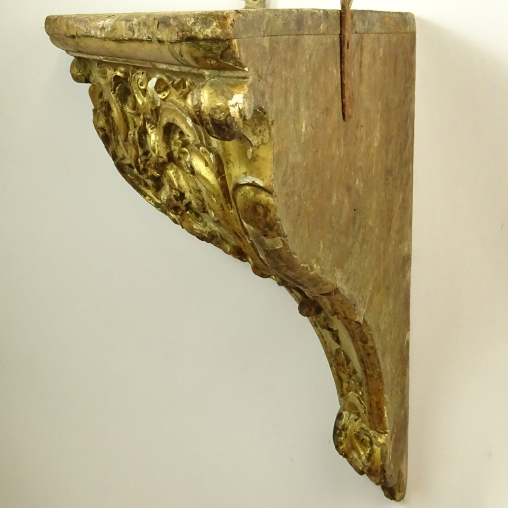 19/20th Century Probably Italian Carved Parcel Gilt Wood Wall Bracket.