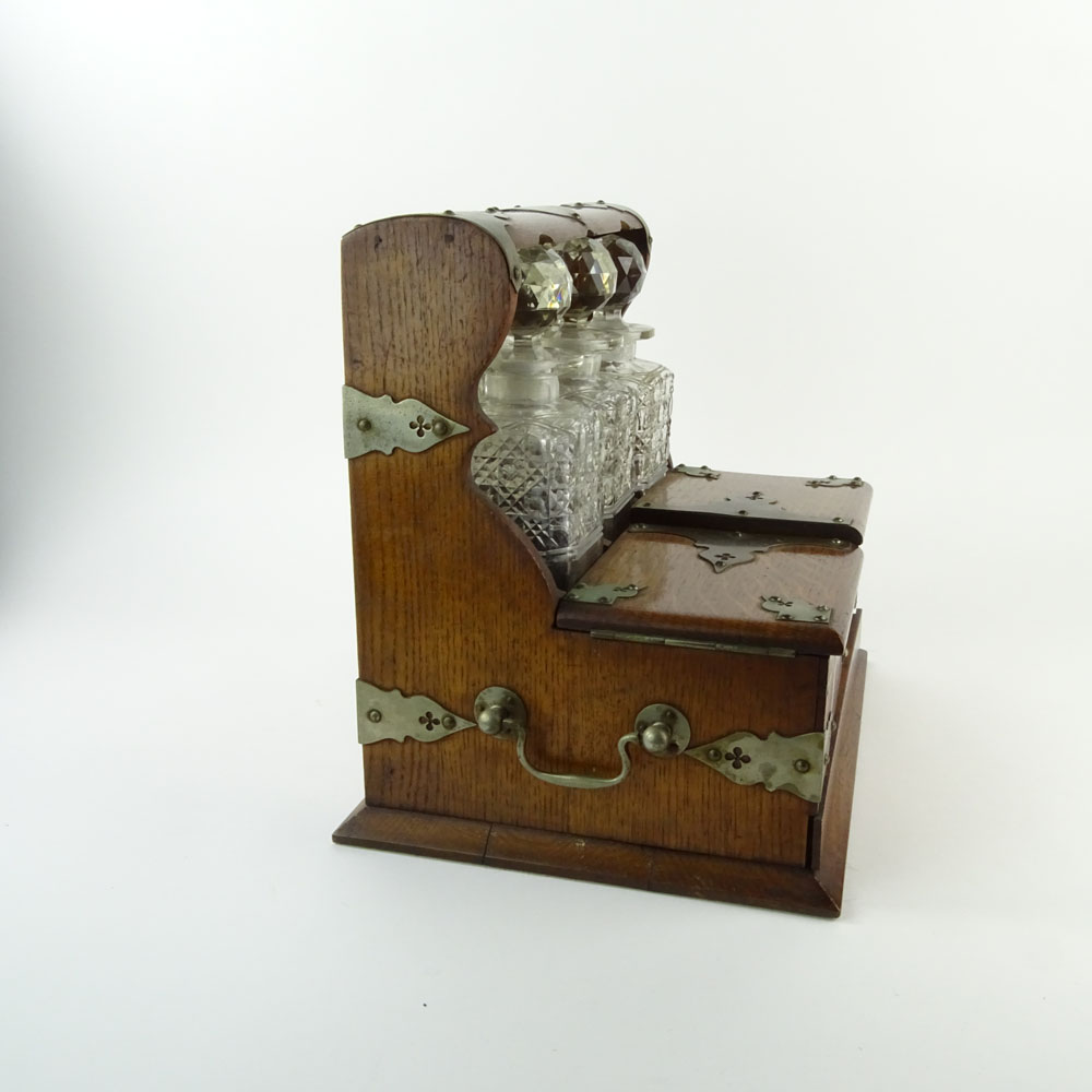 19th Century Bronze Mounted Oak Tantalus with Cut Glass Decanters.