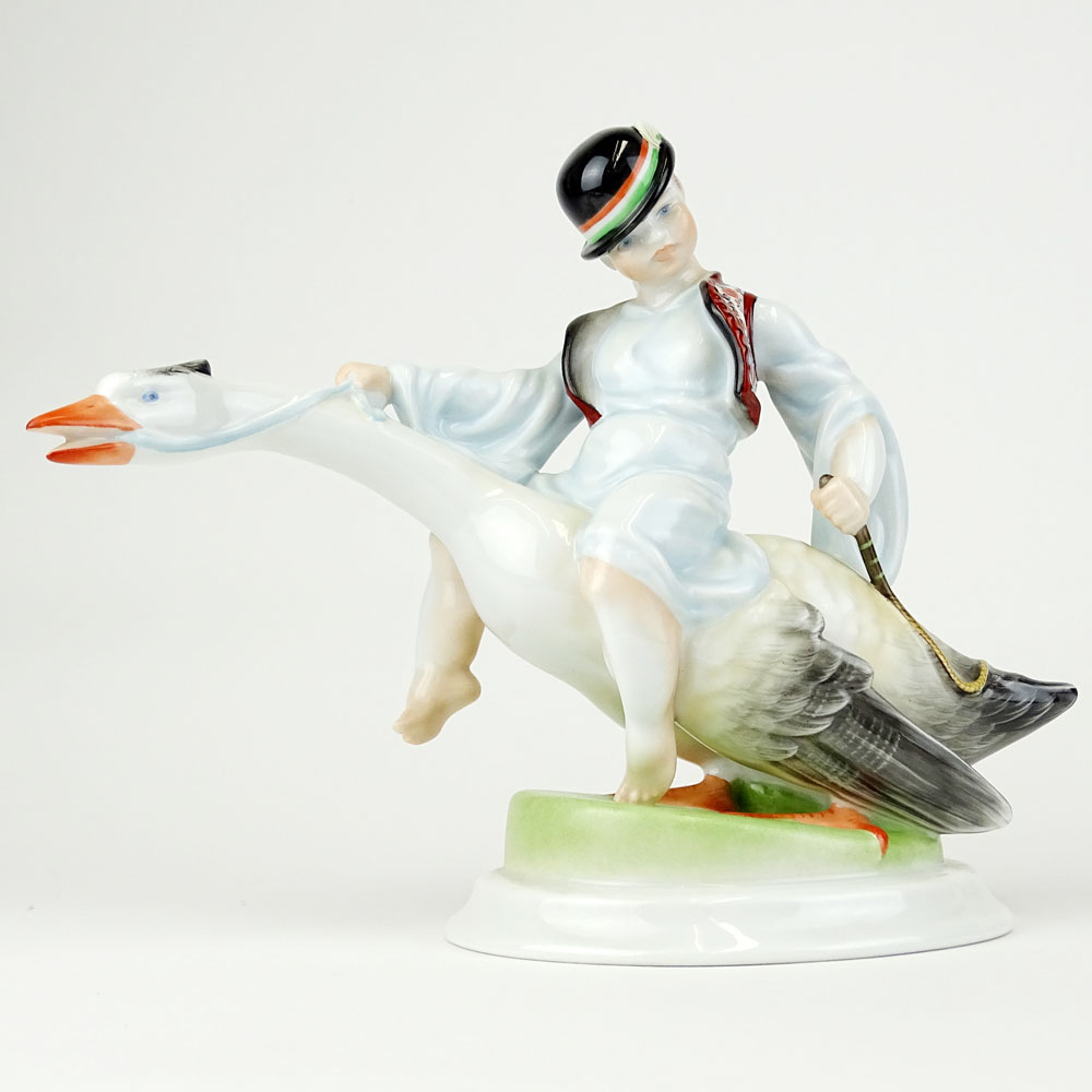 Herend Porcelain Figurine "Boy Riding Goose" Signed with blue Herend backstamp.