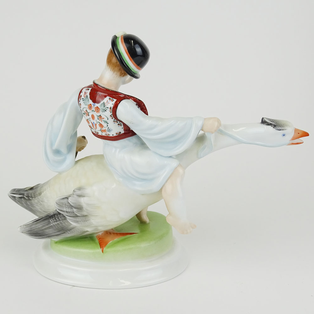 Herend Porcelain Figurine "Boy Riding Goose" Signed with blue Herend backstamp.