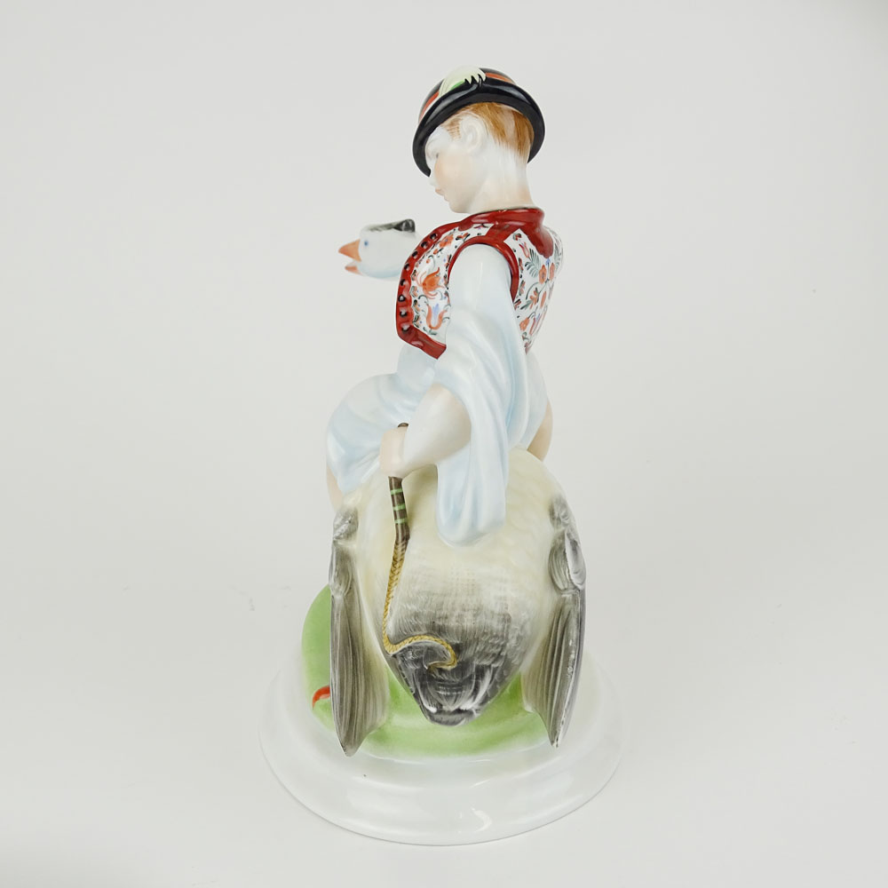 Herend Porcelain Figurine "Boy Riding Goose" Signed with blue Herend backstamp.