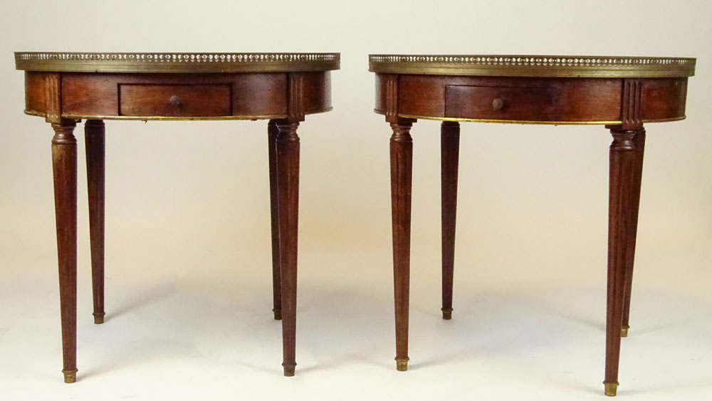 Pair of mid 20th century Italian Louis XVl style mahogany bouillotte tables with marble tops and brass galleries.