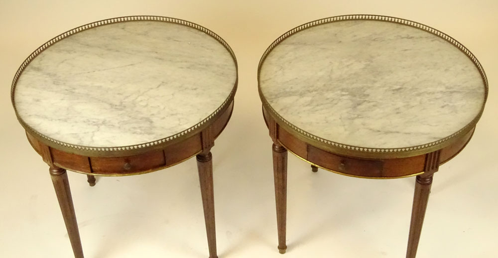 Pair of mid 20th century Italian Louis XVl style mahogany bouillotte tables with marble tops and brass galleries.
