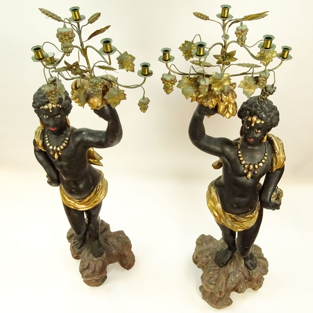 Pair of 19th C Italian Carved Painted and Gilt Wood and gilt tole Blackamoor torchieres.