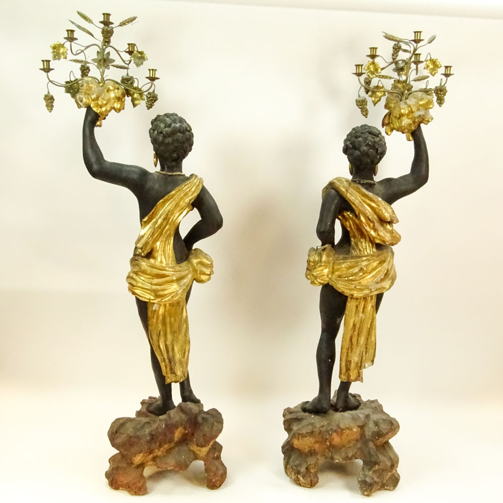 Pair of 19th C Italian Carved Painted and Gilt Wood and gilt tole Blackamoor torchieres.