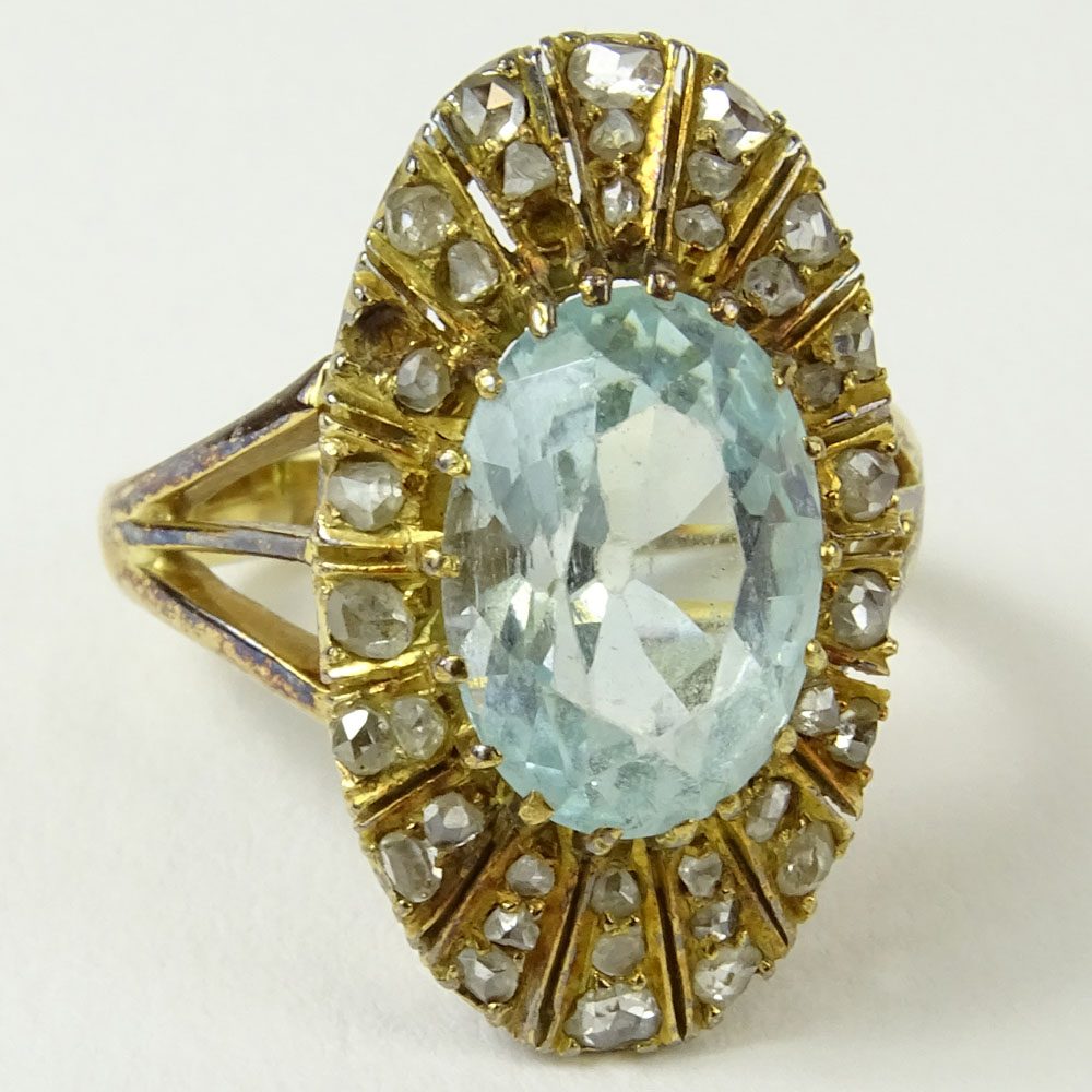 Antique Oval Cut Aquamarine, Rose Cut Diamond and 14 Karat Yellow Gold Ring.